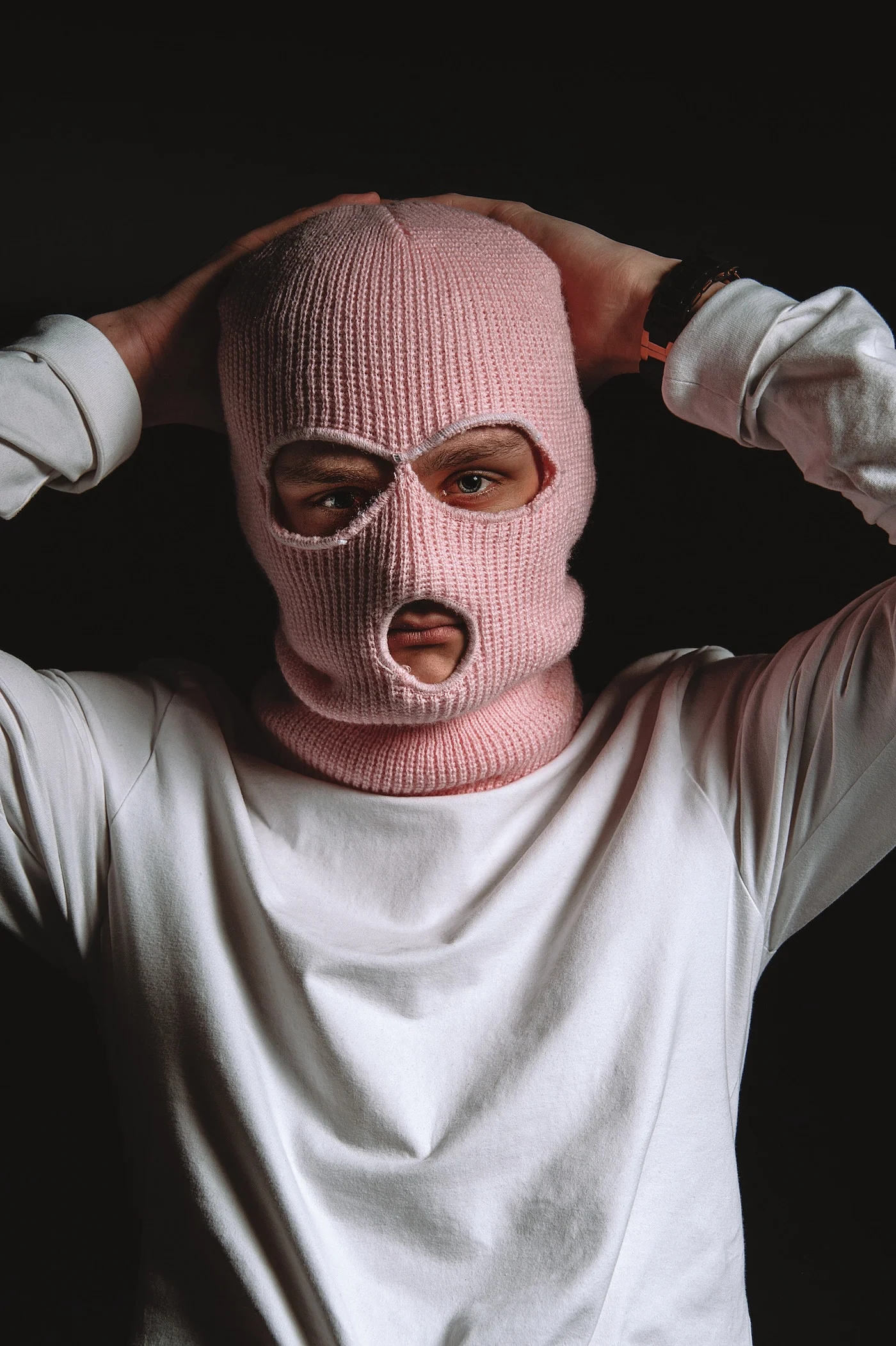 man wearing pink balaclava ski mask