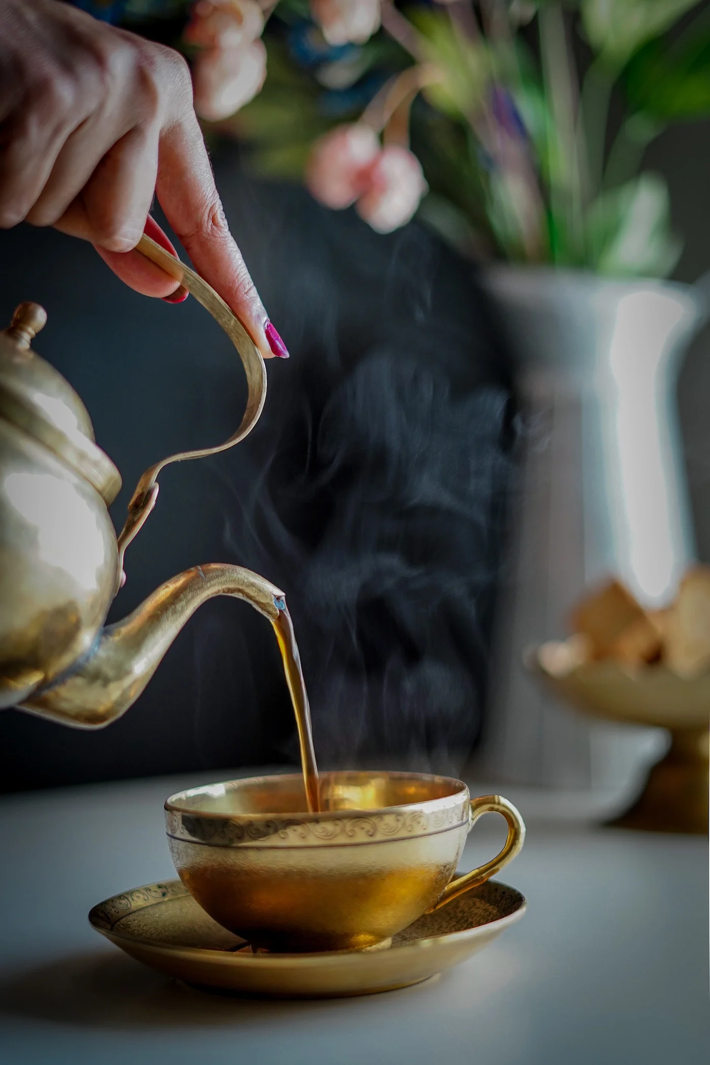 golden tea cup and pot