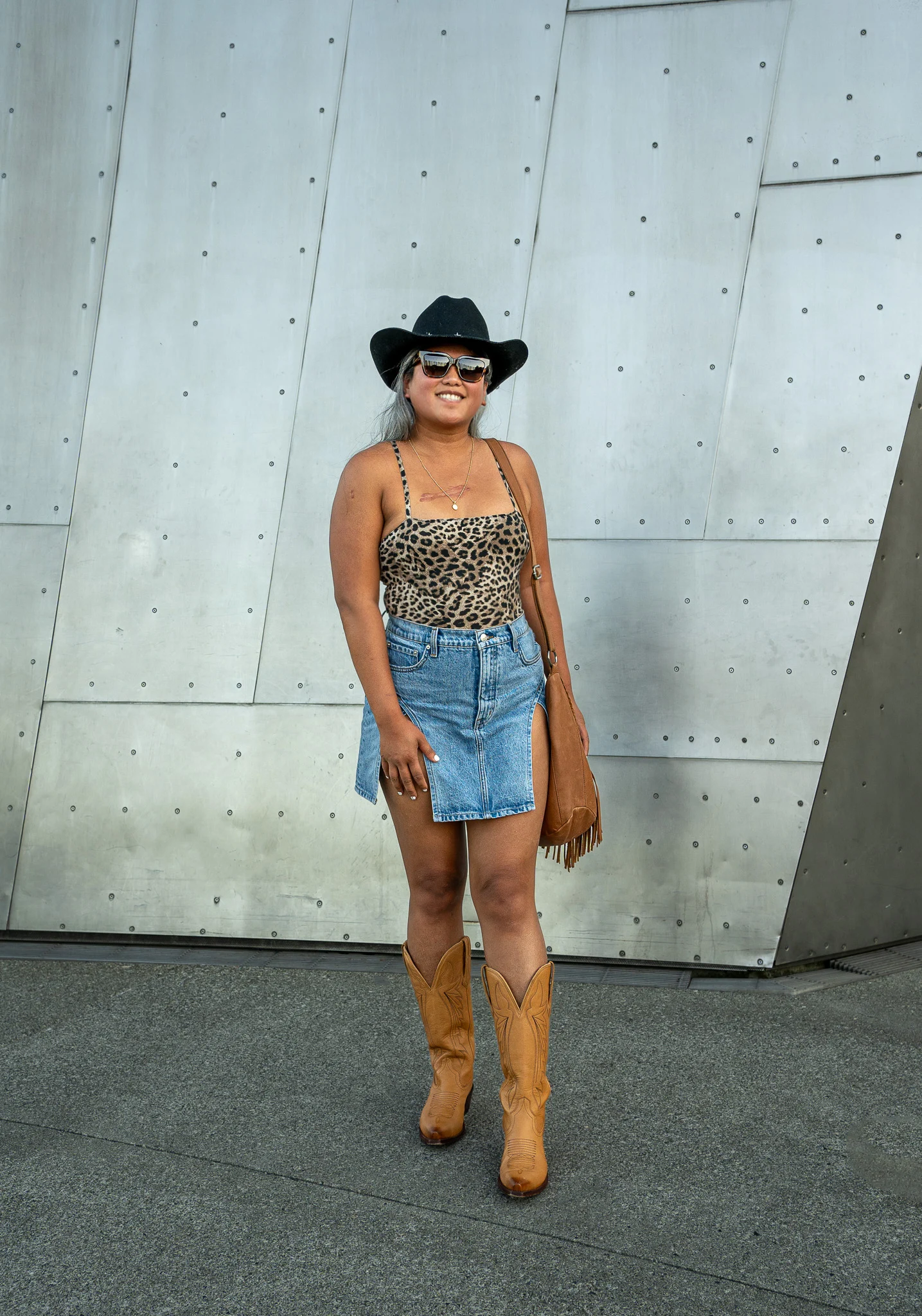 Cowgirl outfit idea GRLFRND Jasmine Skirt Augustine Dolly Hat Spiritual Gangster Leopard Bodysuit Tecovas Western boot