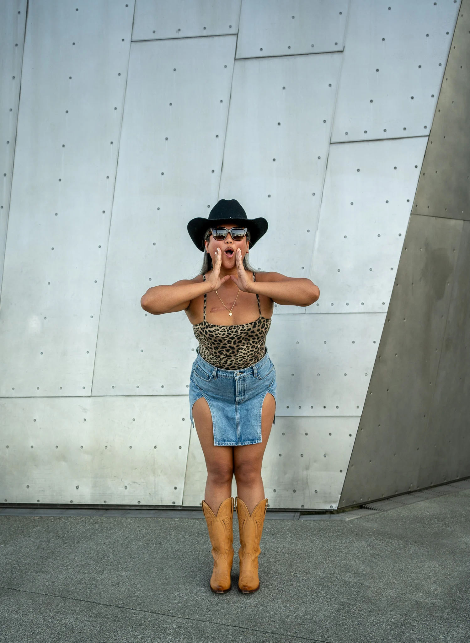 Urban Cowgirl Outfit Augustine hat spiritual gangster leopard bodysuit GRLFRND Jasmine mini skirt Tecovas boots