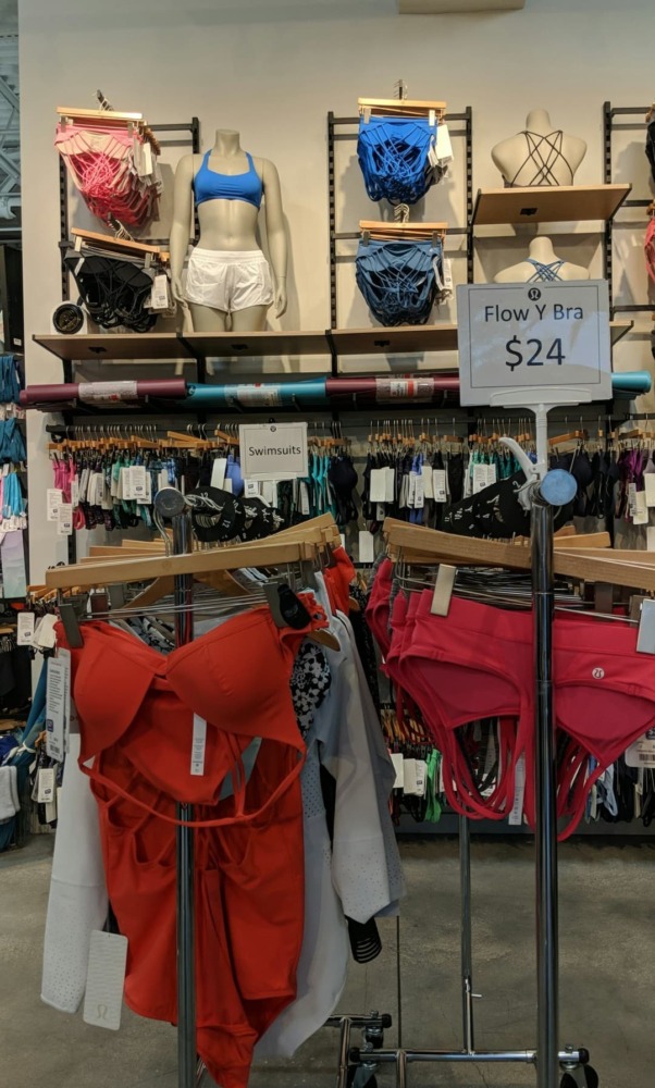 lululemon outlet swimwear rack and sport bra wall