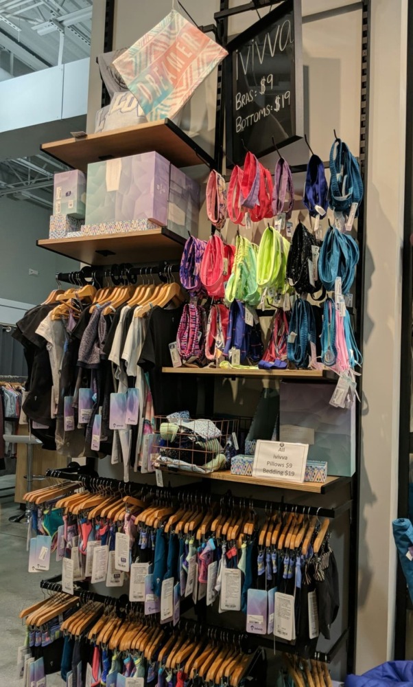 Ivivva wall filled with accessories and clothing for young girls. 