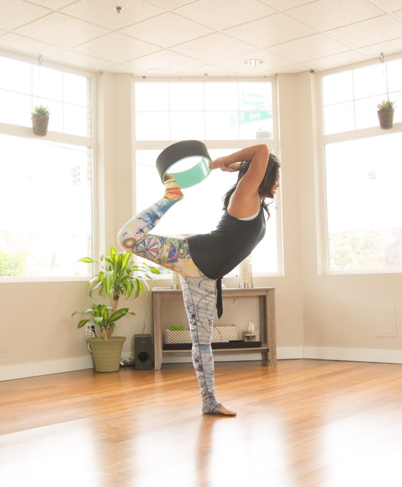 Natarajasana or Dancer's Pose with a Yoga Wheel