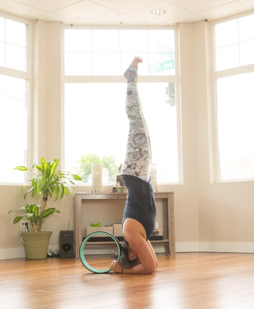 Salamba Sirsasana or Headstand with a Yoga Wheel