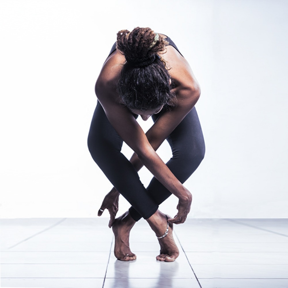 woman yoga pose foward fold uttanasana variation schimiggy reviews