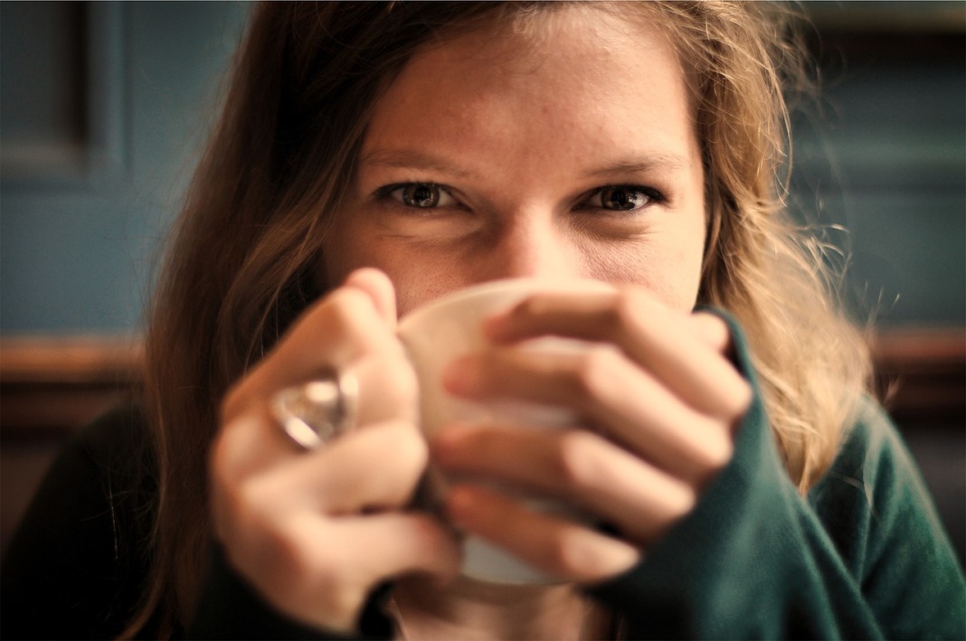 girl drinking tea or coffee