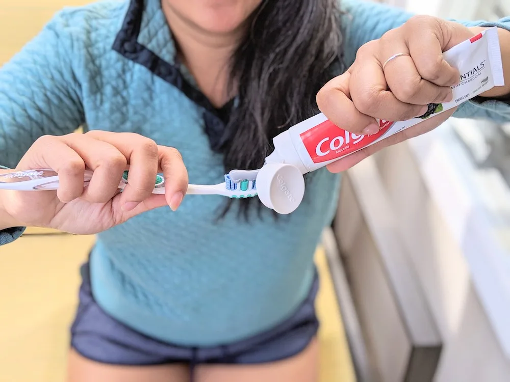colgate charcoal toothpaste on toothbrush