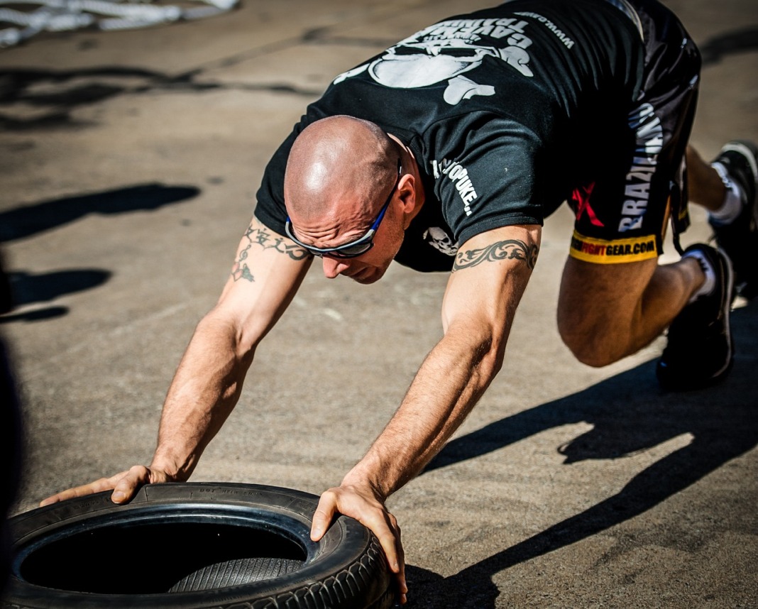 man wearing sunglasses working out