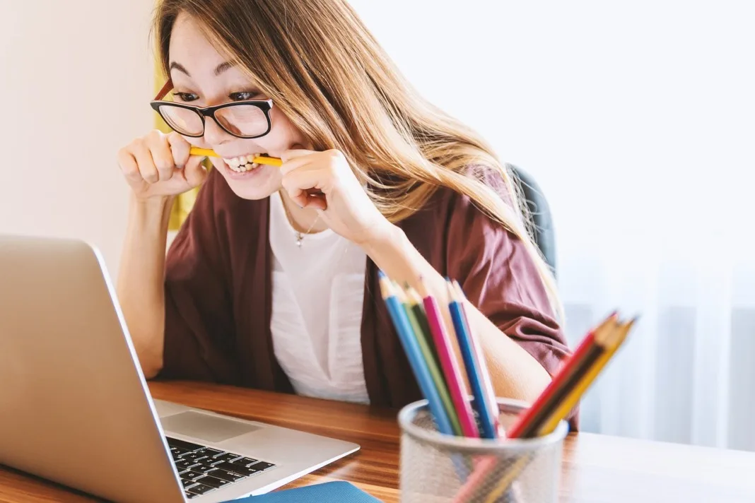 stressed young woman studying for college exam