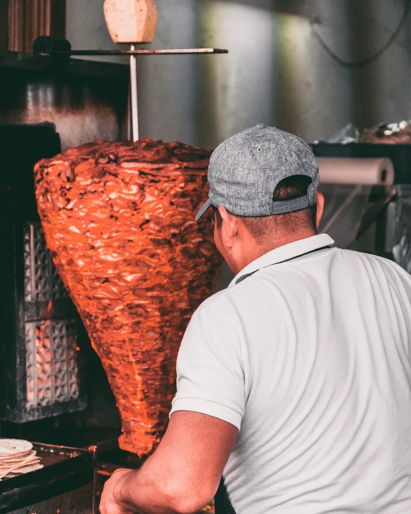 tacos al pastor spit meat and food in mexico city