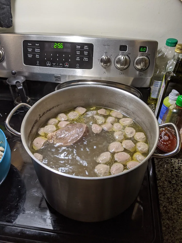 chicken and beef pho broth with meatballs