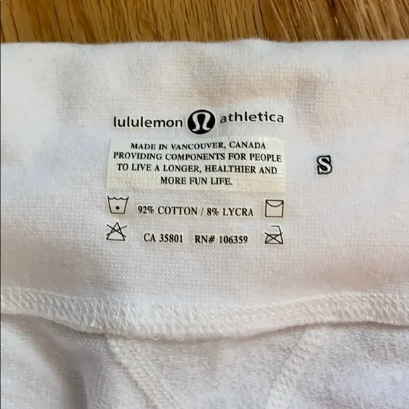 fake lululemon product information on white crop pants