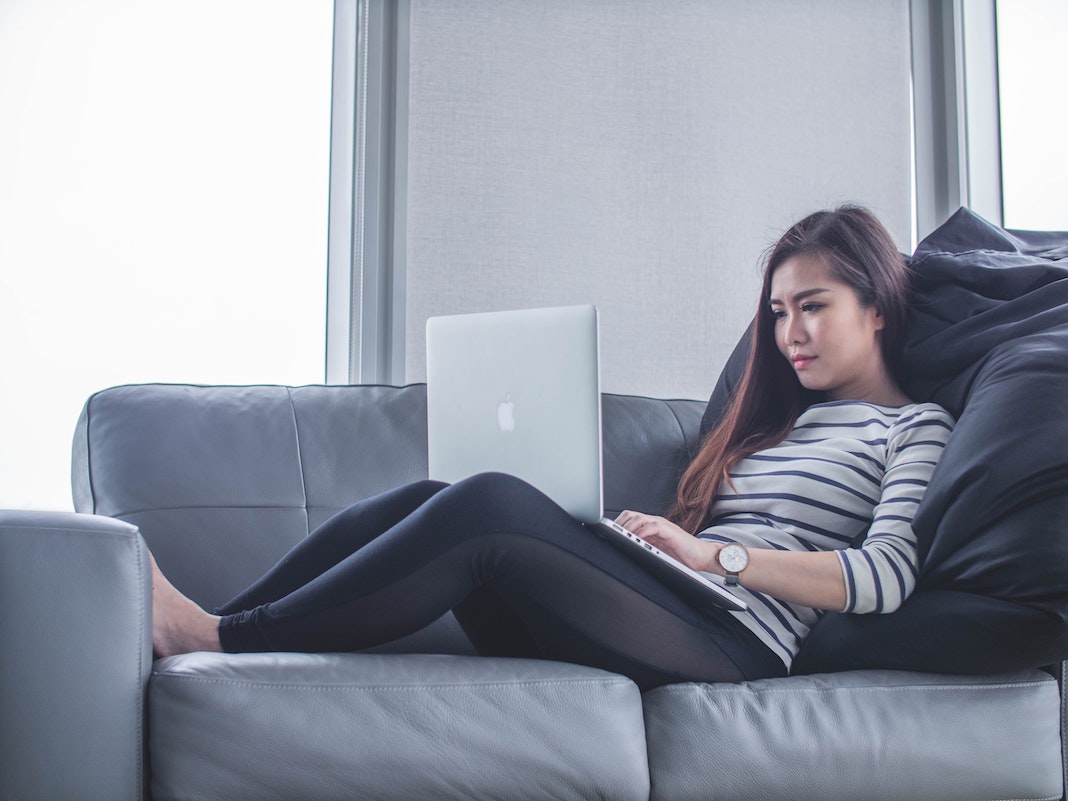 woman working from home on sofa