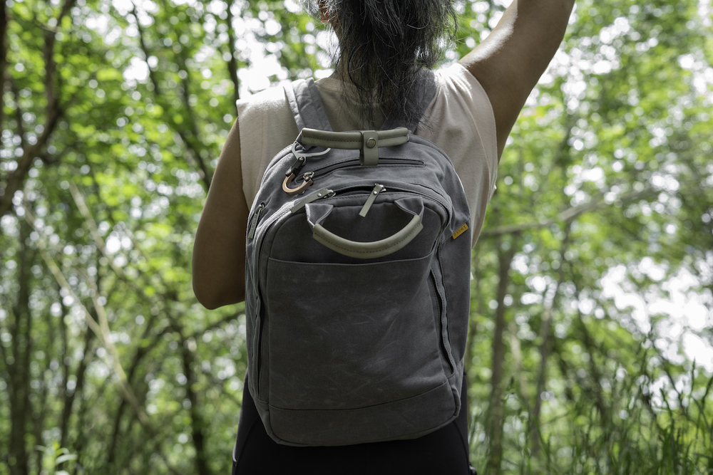 wearing day owl backpack on a hike