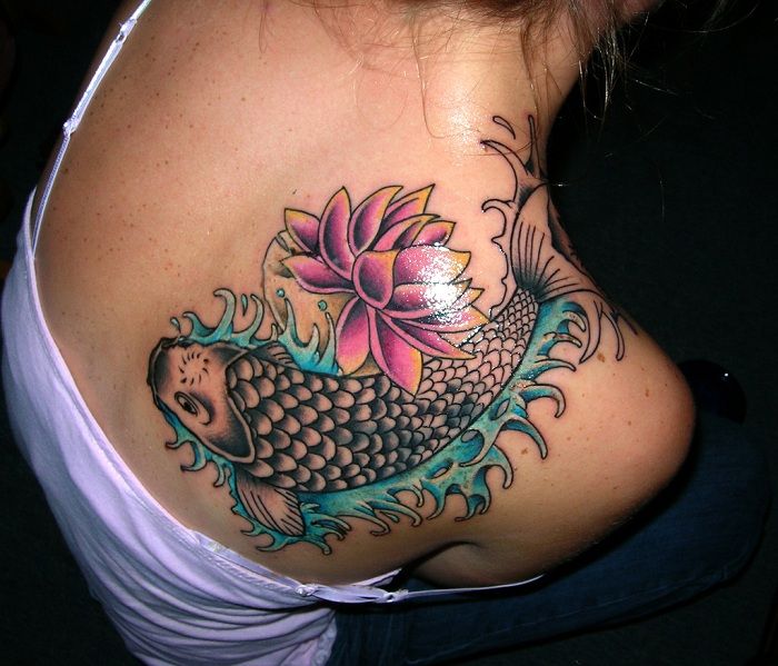 koi fish tattoo on shoulder and back