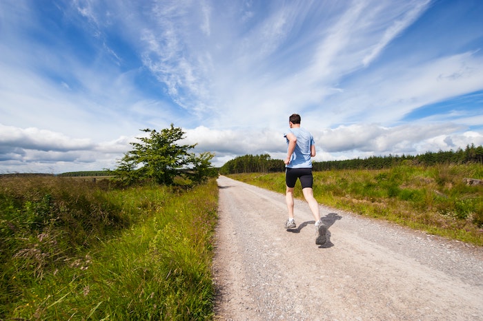 healthy man running outdoors