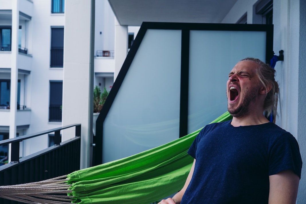 man yawning and lacking energy