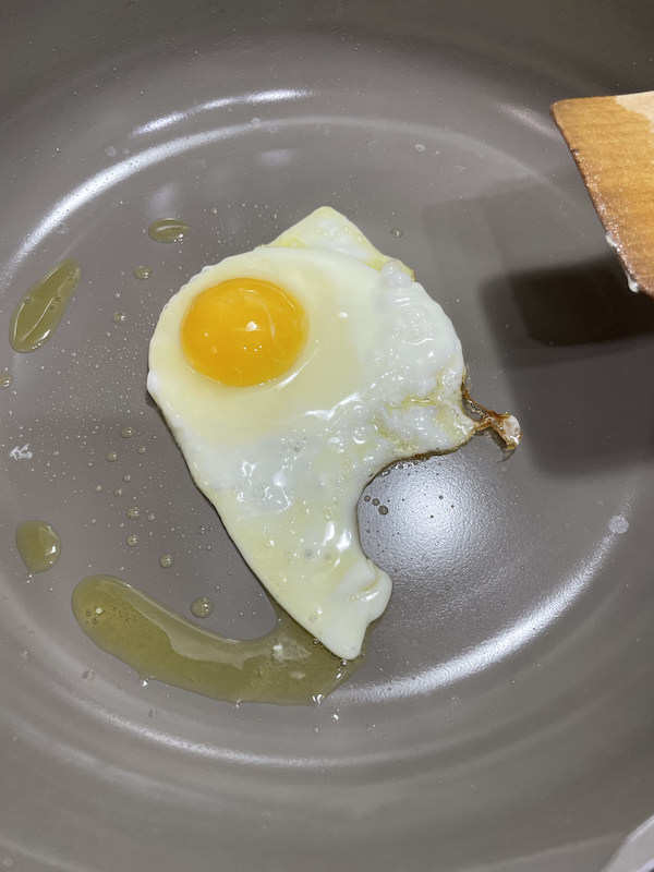 cooking fried egg on our place always pan