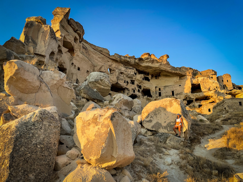 Cavusin Castle in Cappadocia during golden hour sunset atv tour