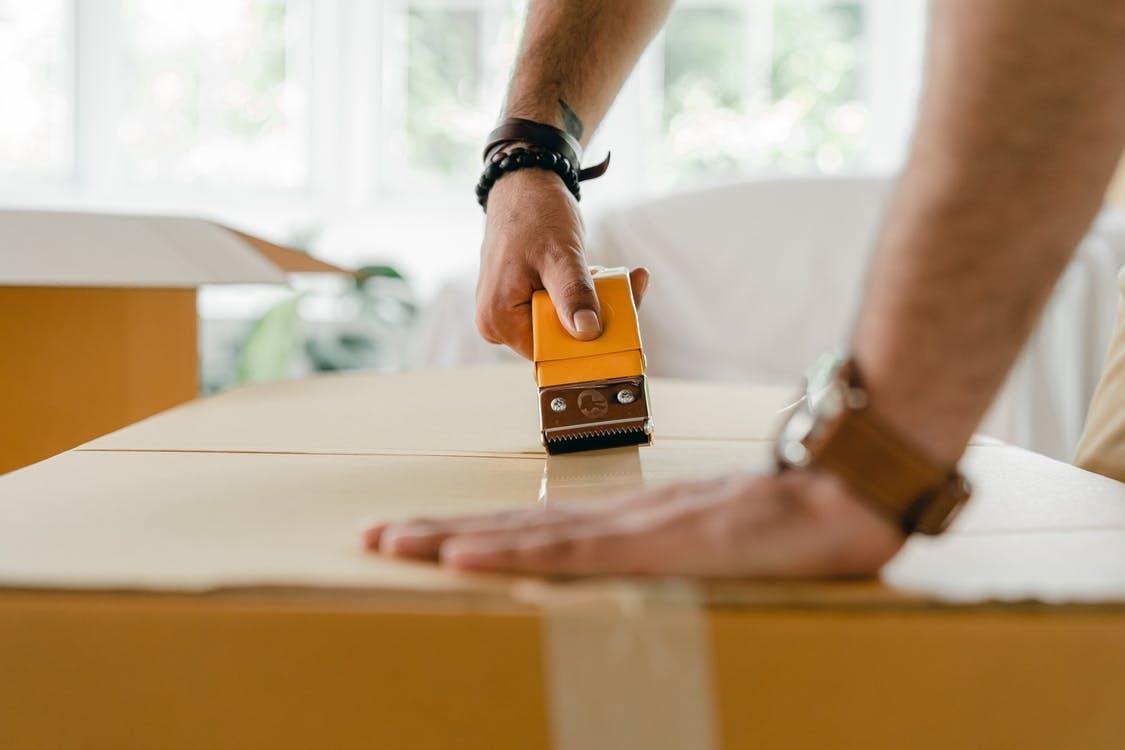 packing moving boxes with tape