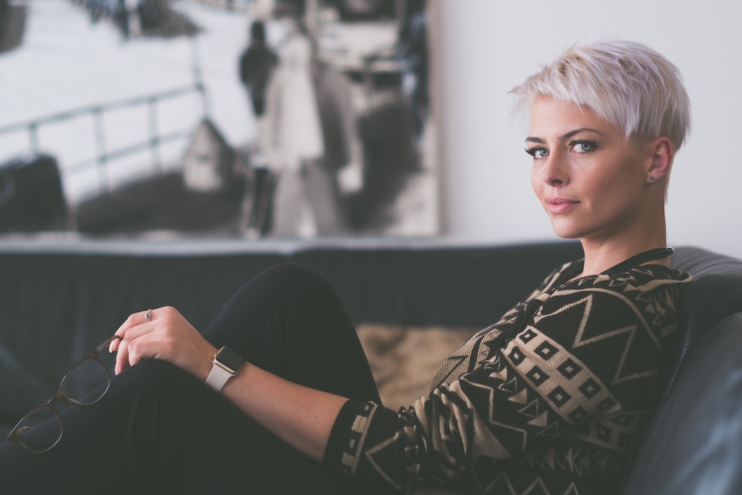 modern woman sitting on sofa