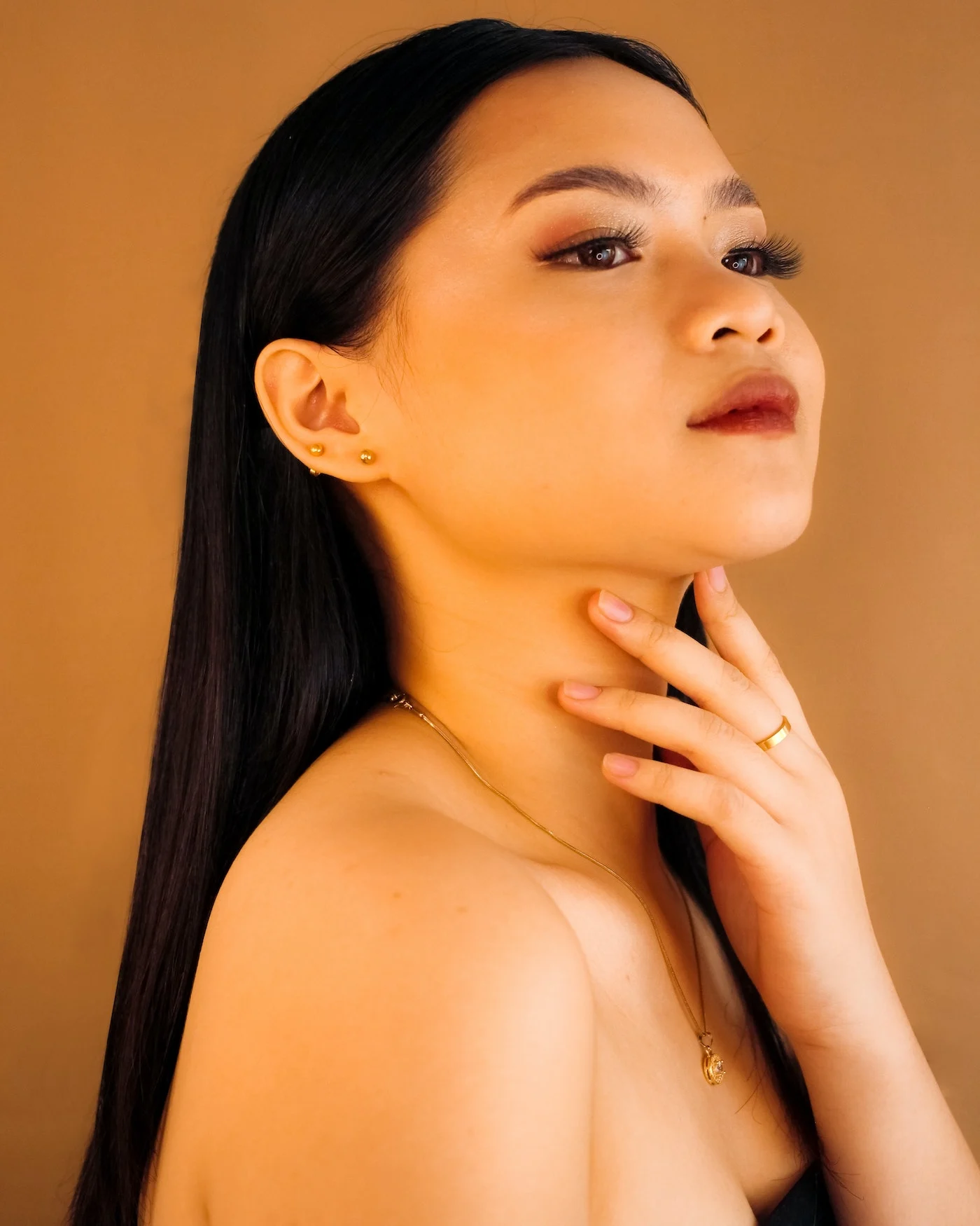 asian woman wearing hypoallergenic jewelry